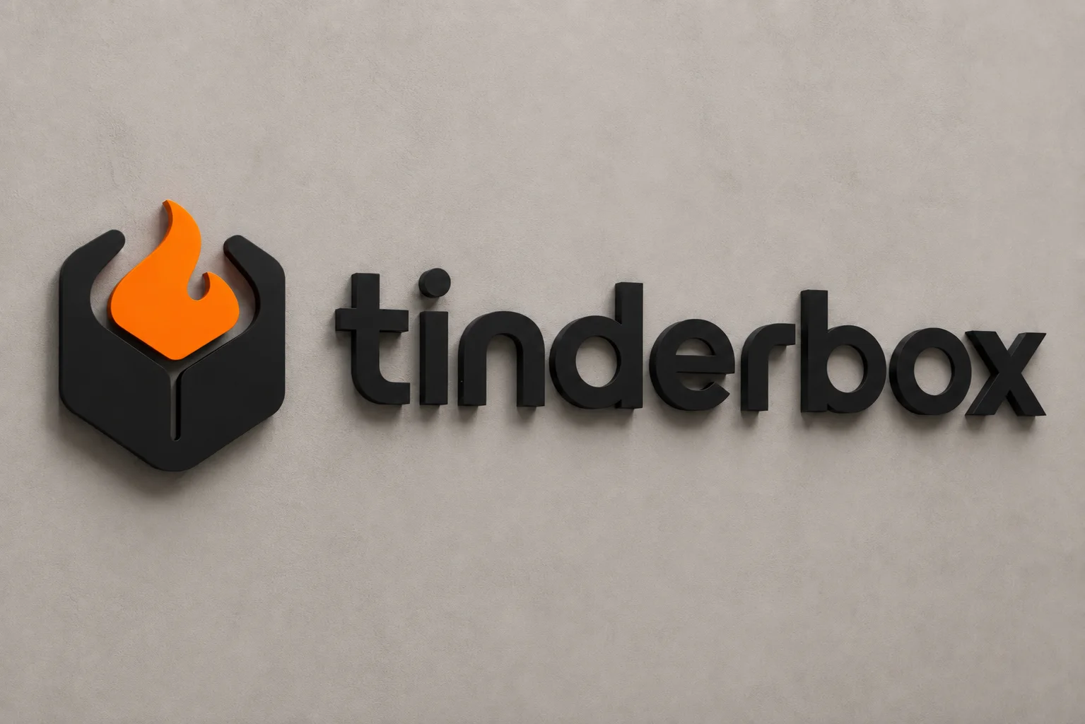 the tinderbox mark and wordmark mounted on the studio wall